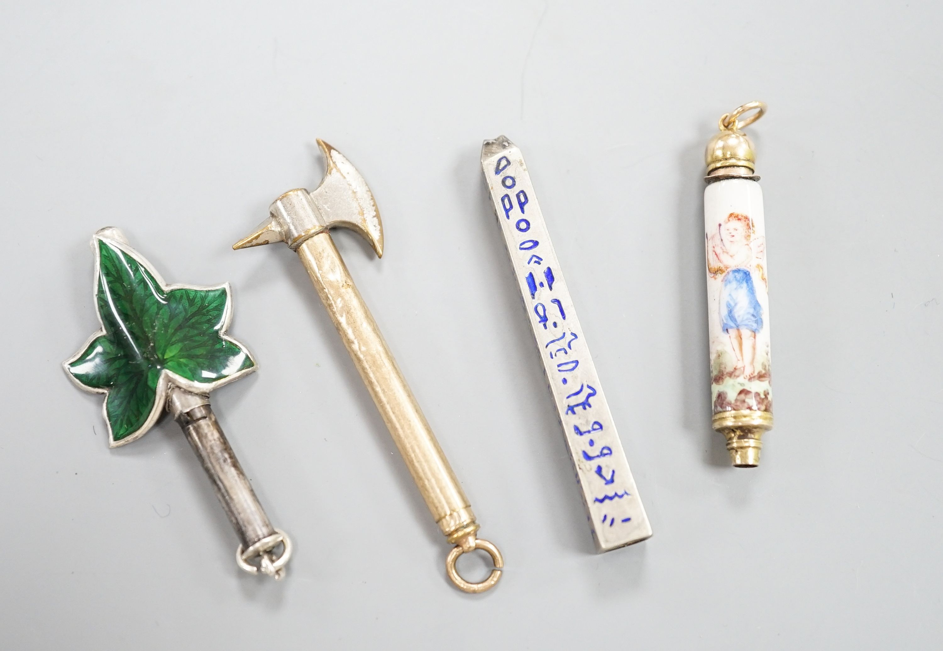 Four assorted pencils, including three enamelled and novelty modelled as an axe